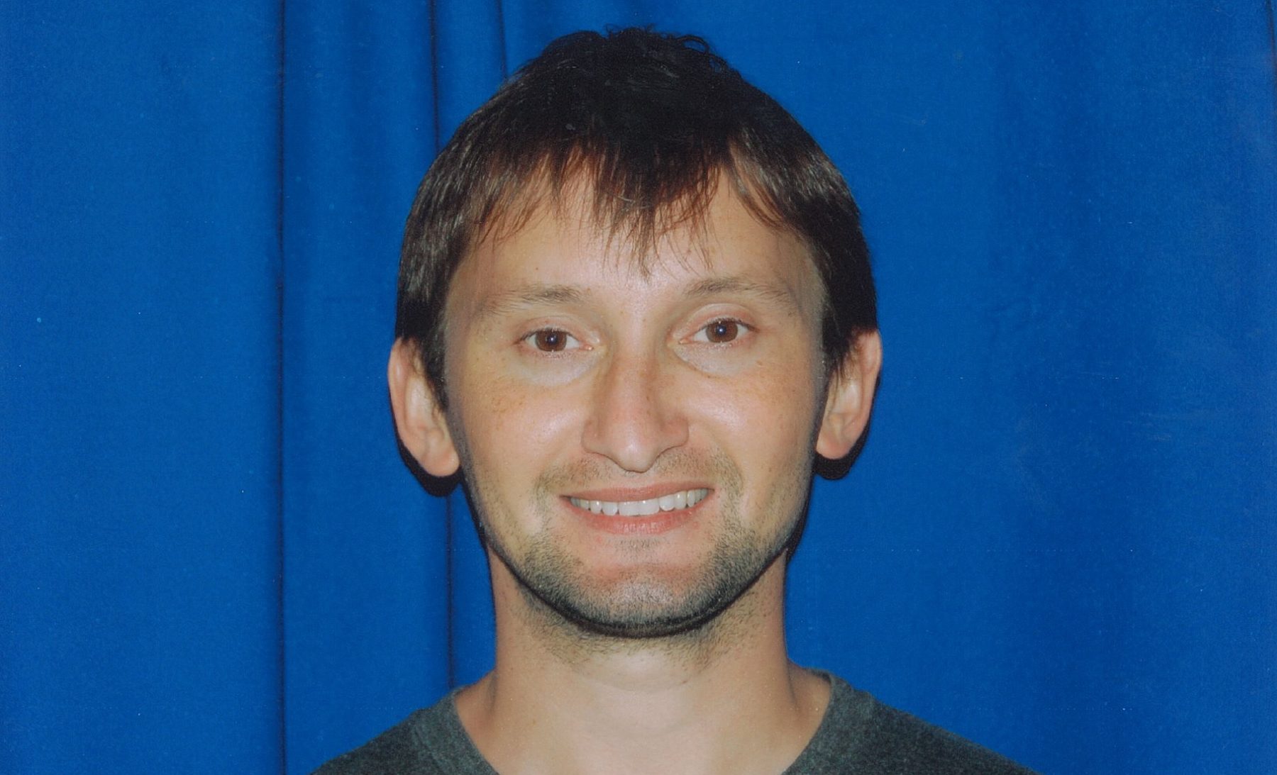 A headshot photo of Ramil Sarkulov.