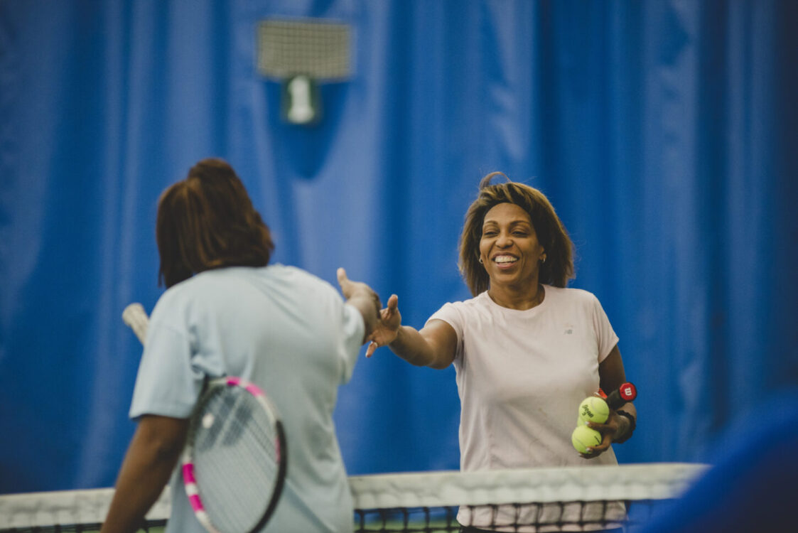 Two people playing tennis