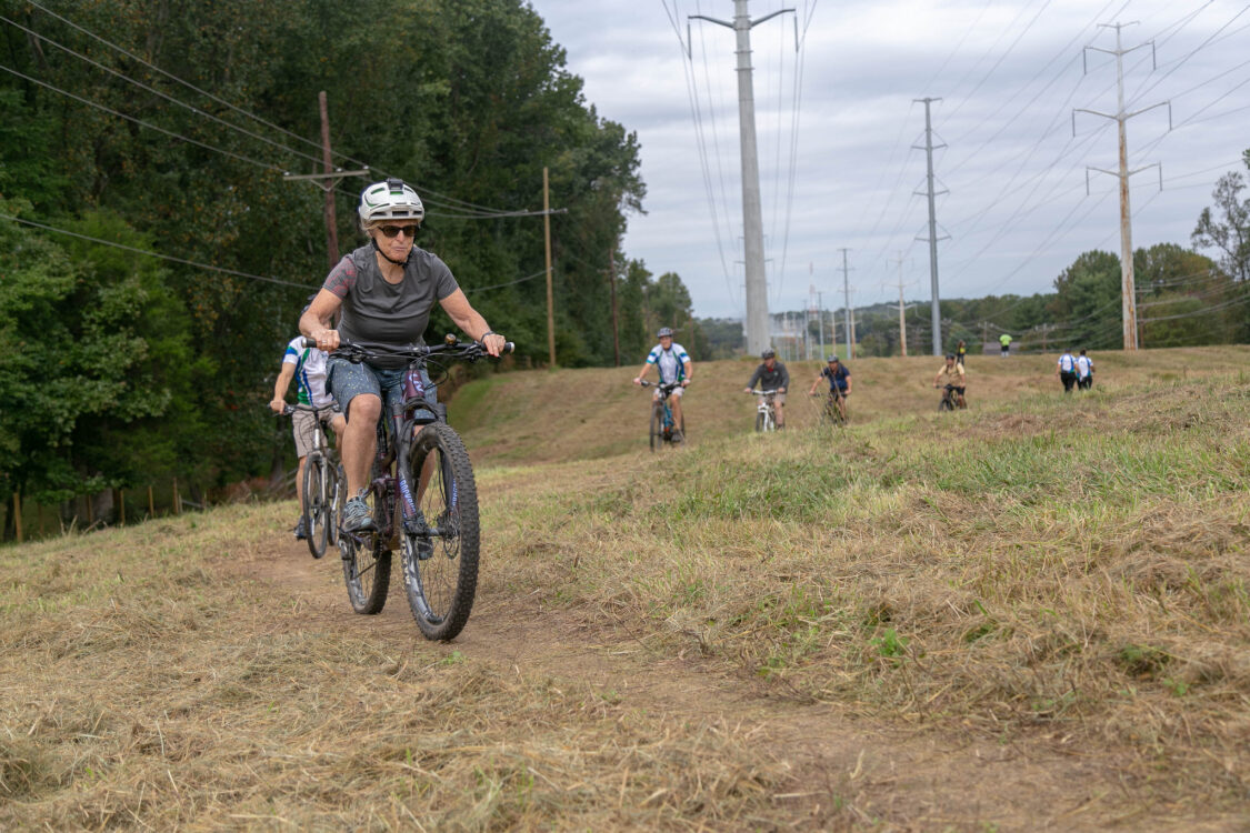 person biking on the Powerline Trail