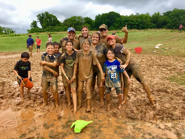 park visitors people playing in the mud