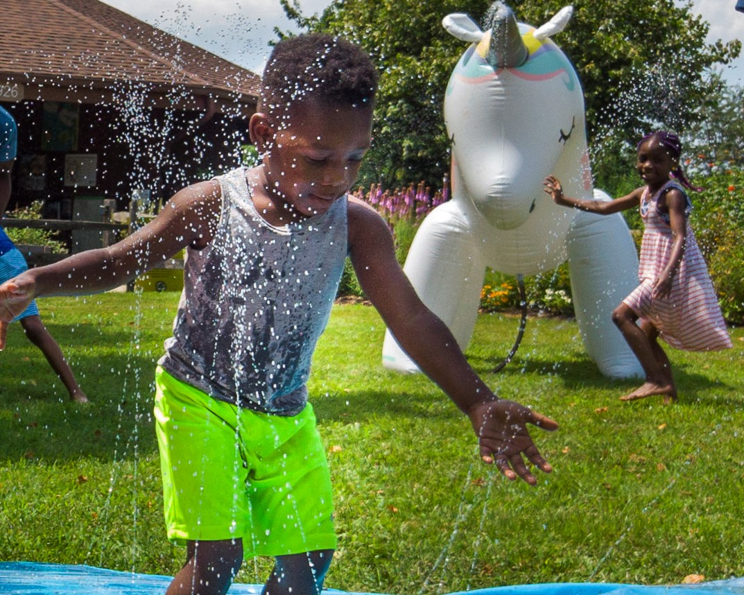 Children Playing in Sprinklers at the Black Hill Visitor Center