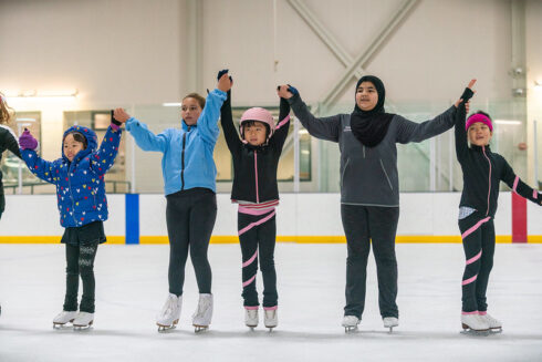 skaters holding hands