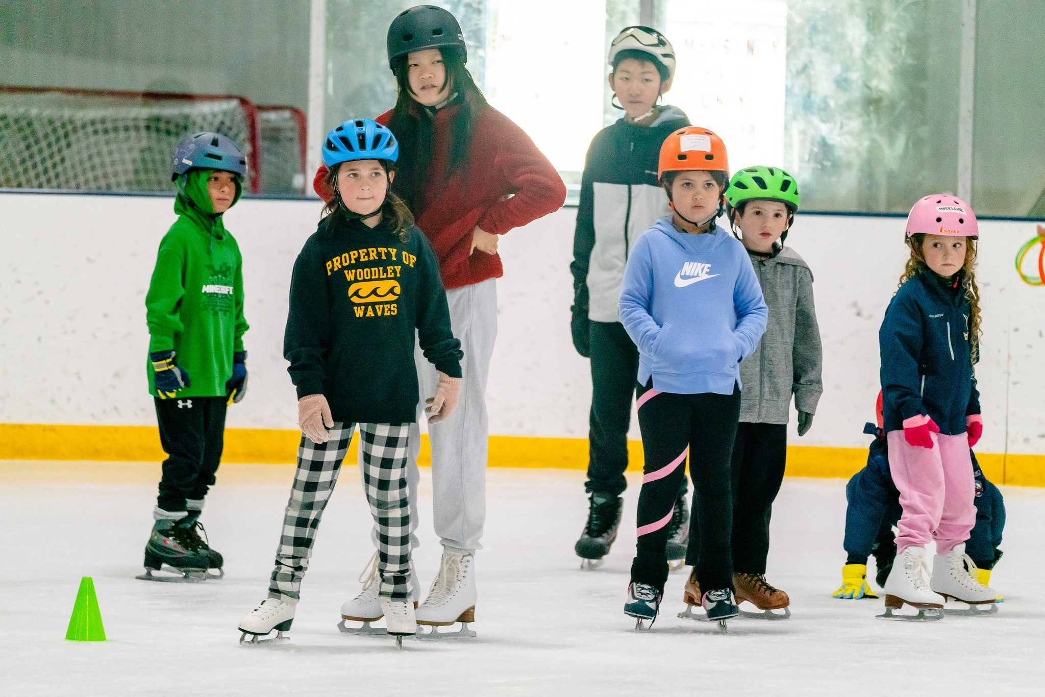 groups of kids standing on the ice 