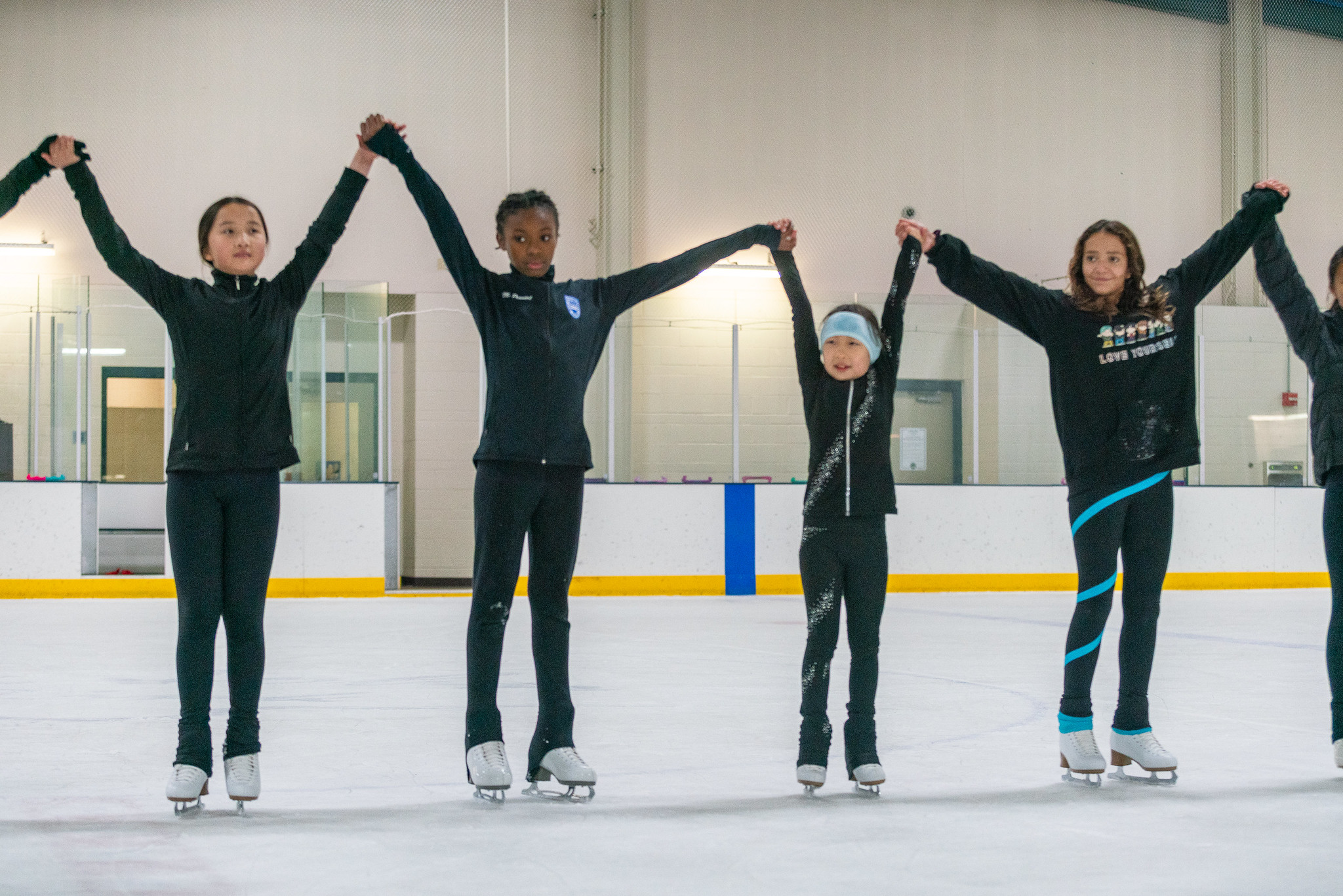 group of kids learning how to skate at theater camp