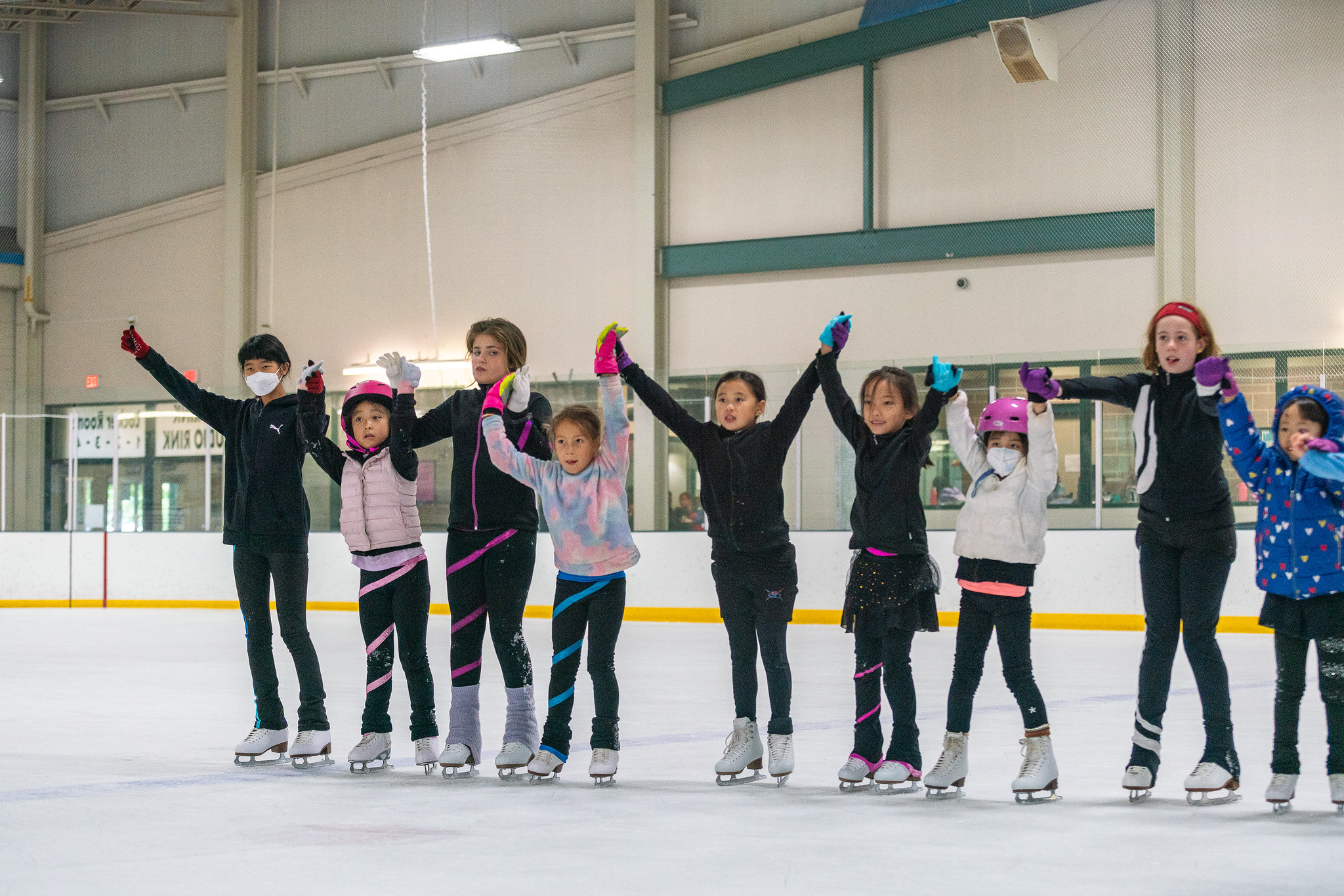 group of kids learning how to skate at theater camp