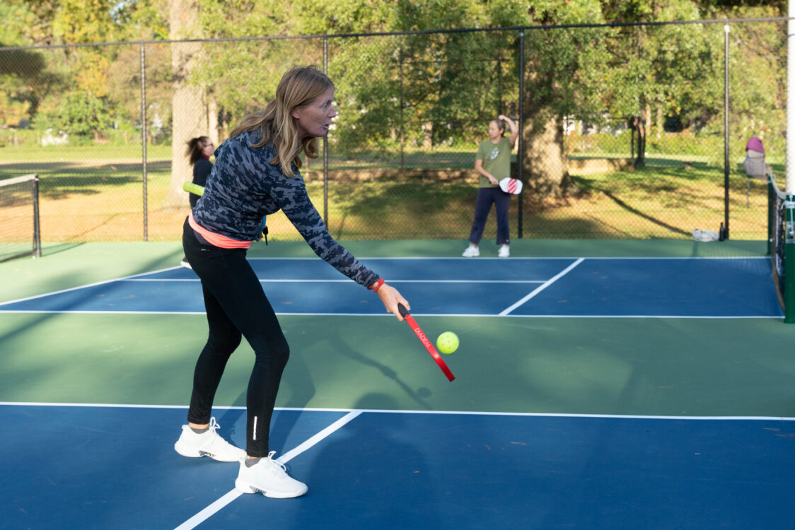 patrons playing pickleball