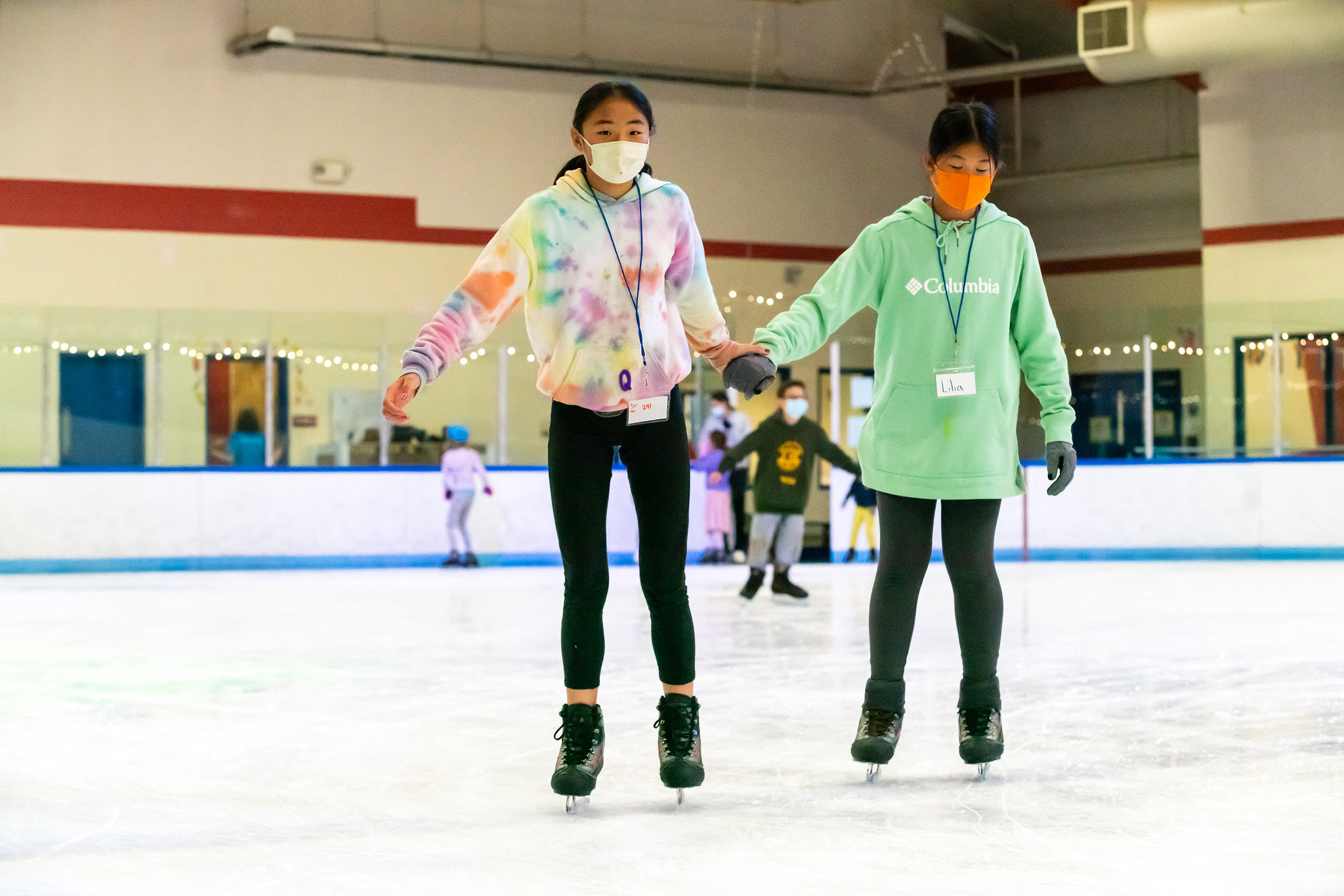 two students learning to skate