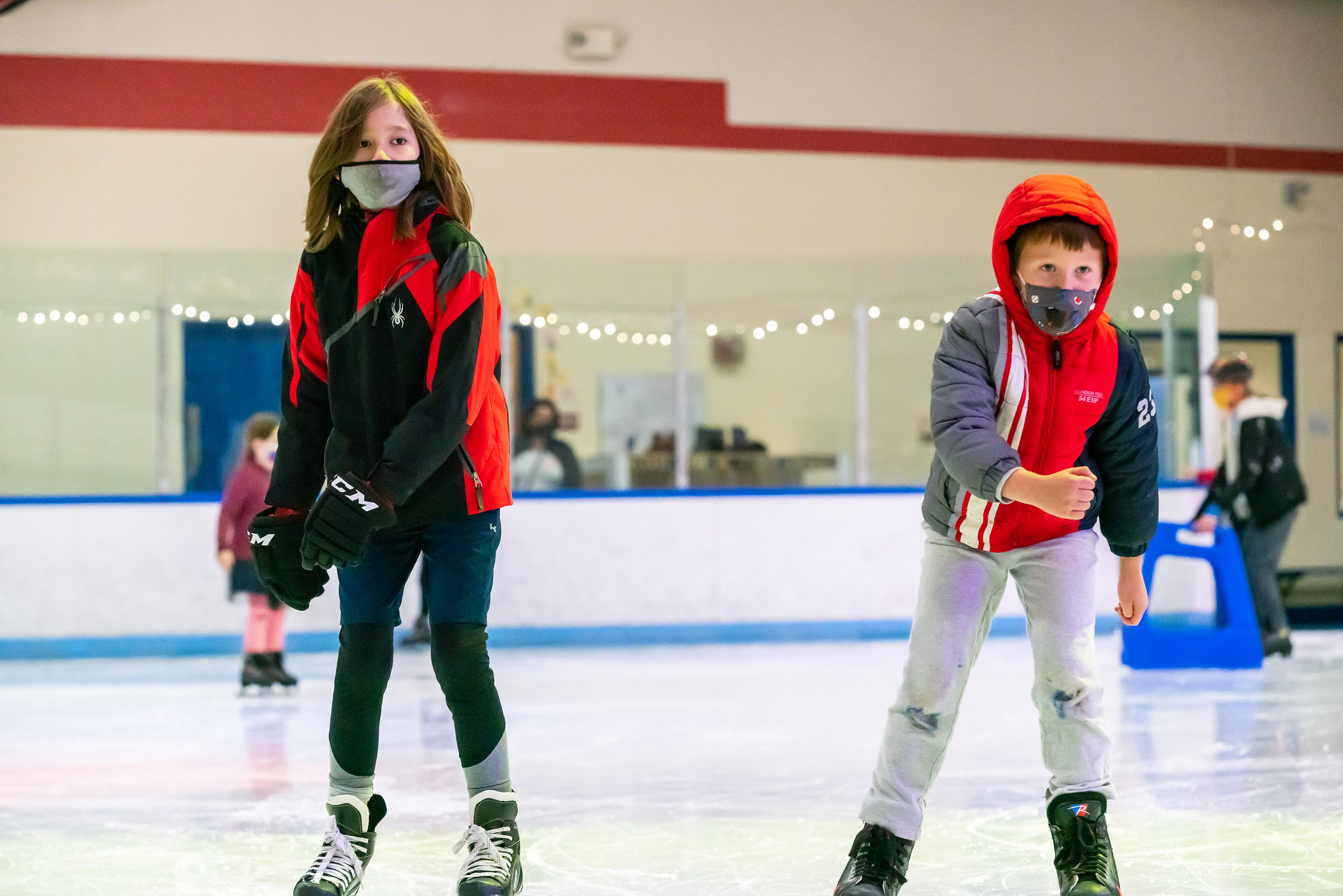 two kids learning to skate at wheaton ice