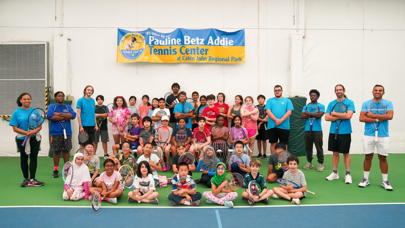 group photo campers at indoor tennis summer camp