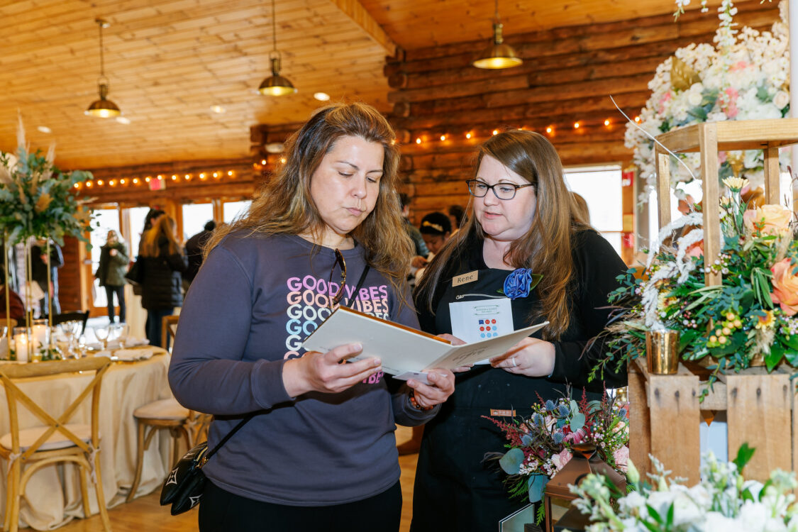 visitors reviewing a caterer at the seneca lodge