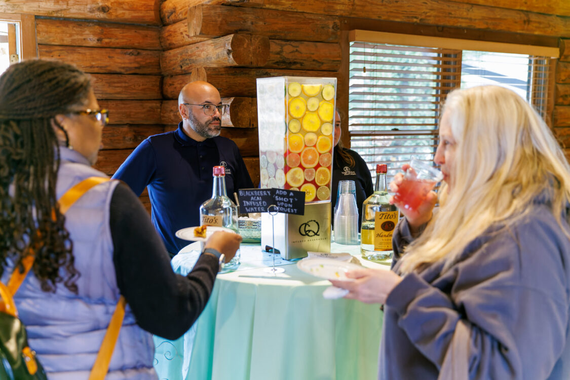 visitors at high top table eating and drinking open house seneca lodge