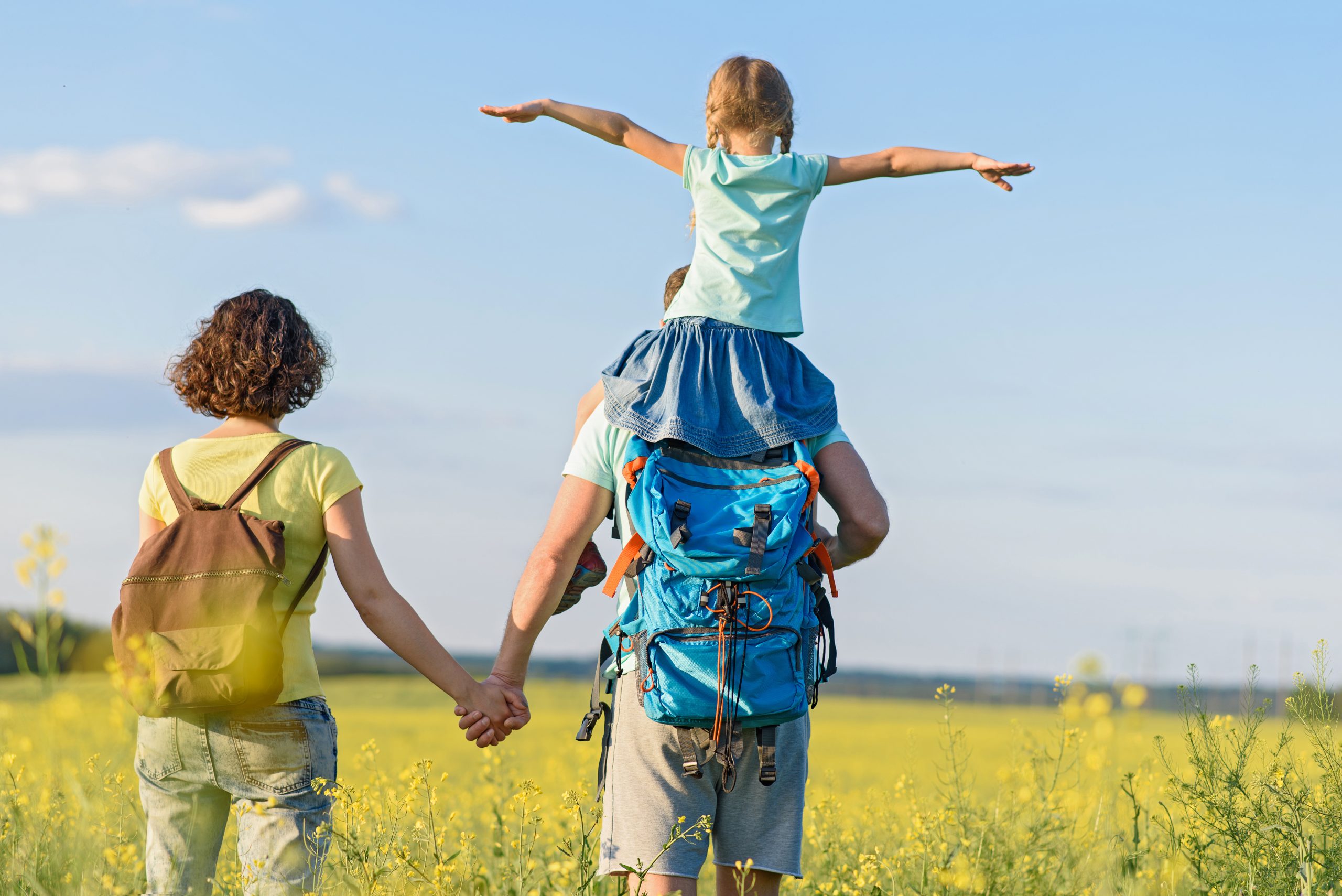 Young family hiking on mountain