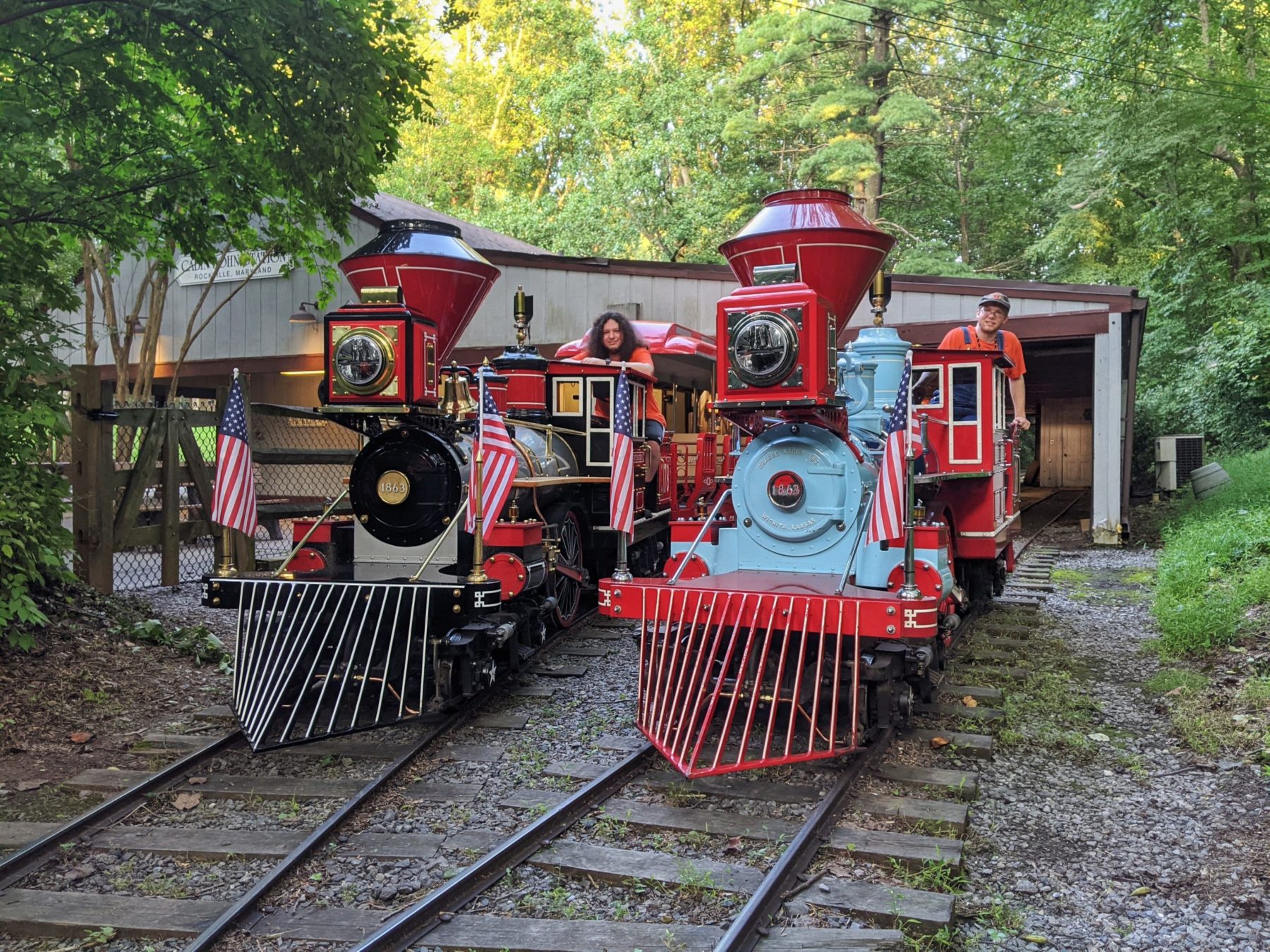 Cabin John Train locomotives 281 and 378 parked outside of station.