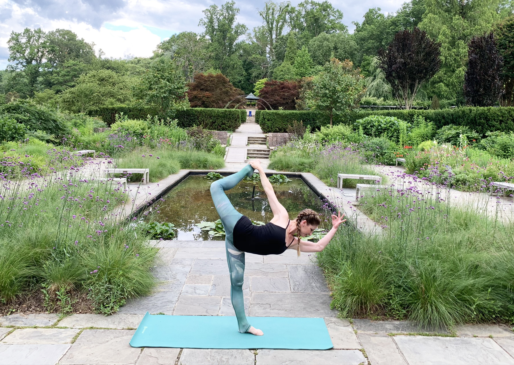 adult yoga pose in the Brookside Gardens' Perennial Garden