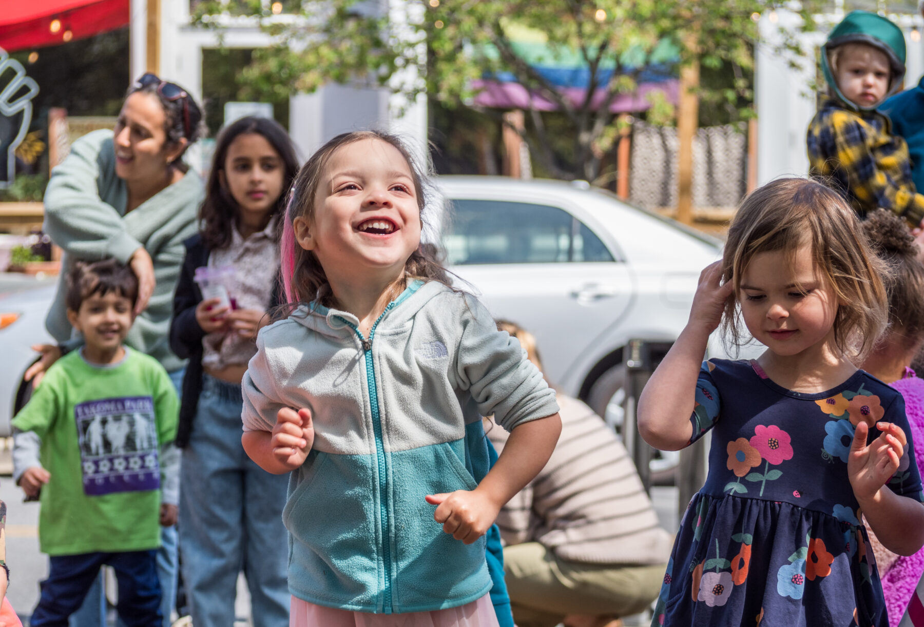 close up of little girl dancing and smiling at a ms niki workshop