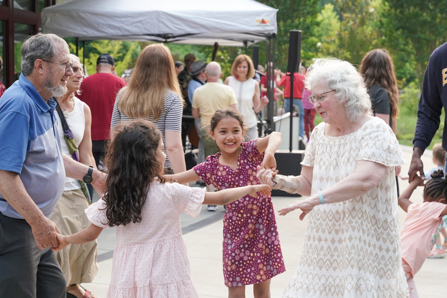 Adults dancing with kids