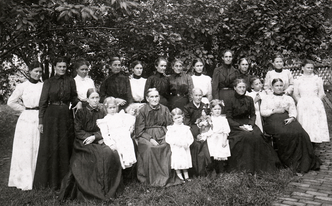 A black and white photo showing seated and standing women and girls of the Women’s Commonwealth of Washington