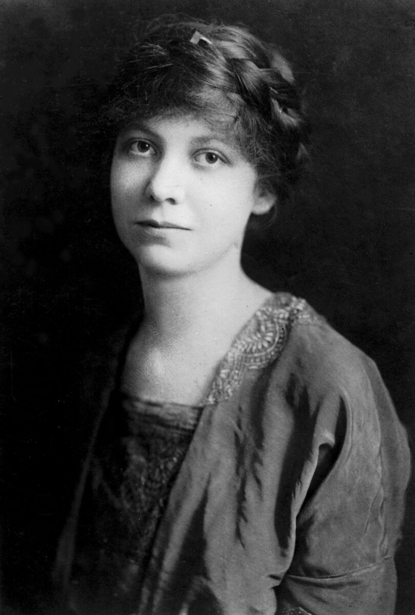 Black and white photograph of Lavinia M. Engle as a young woman. She is wearing a dark lace-trimmed dress, and her hair is in a braid, wrapped around her head.