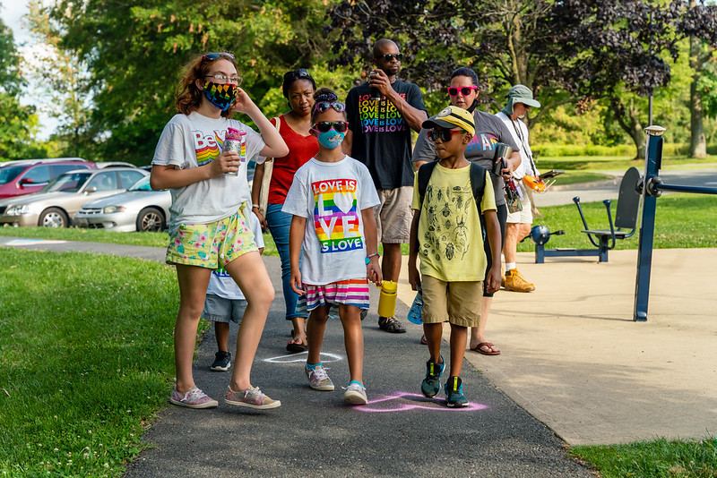 family walking in pride parade 