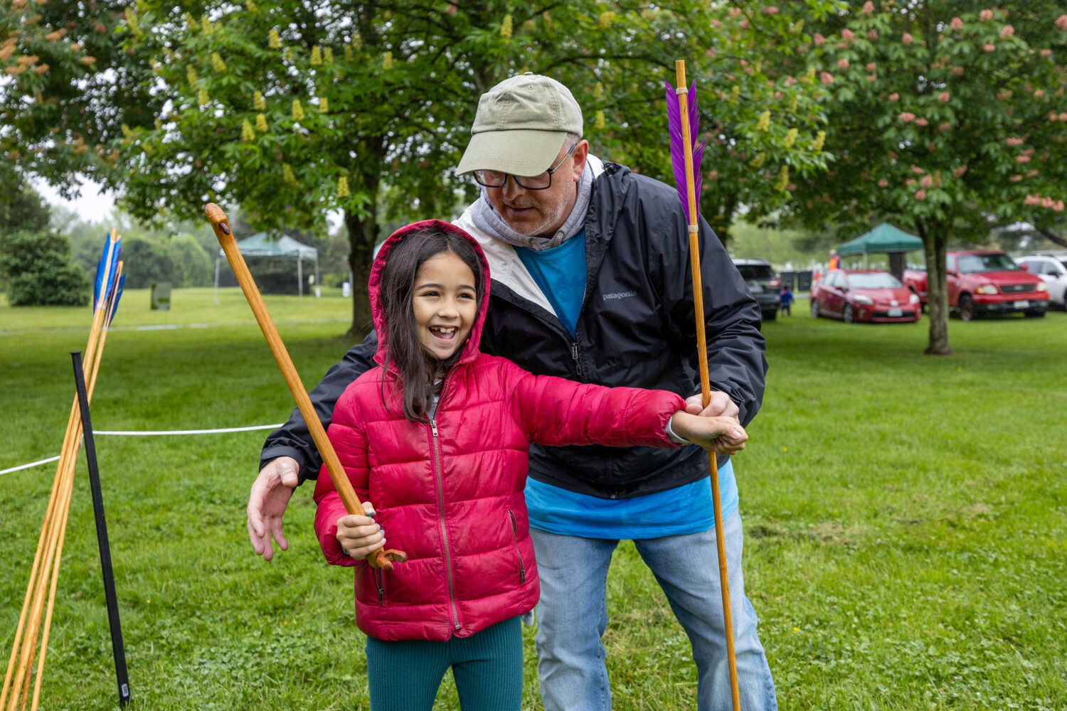 A kid smiling doing an activity at Archaeology Day