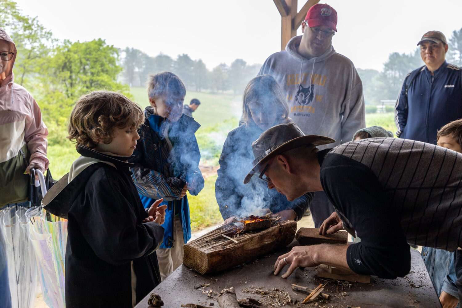 Kids looking at a fire building activity