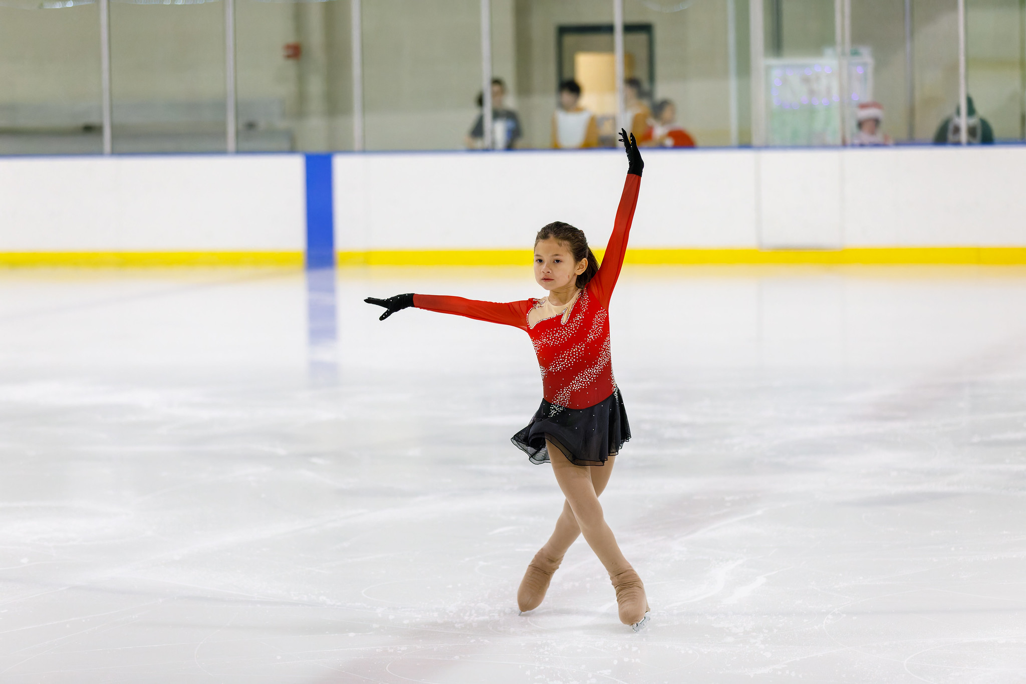 cabin john ice show child holding pose on the ice