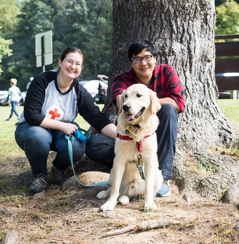 a couple and their dog at the ale trail event