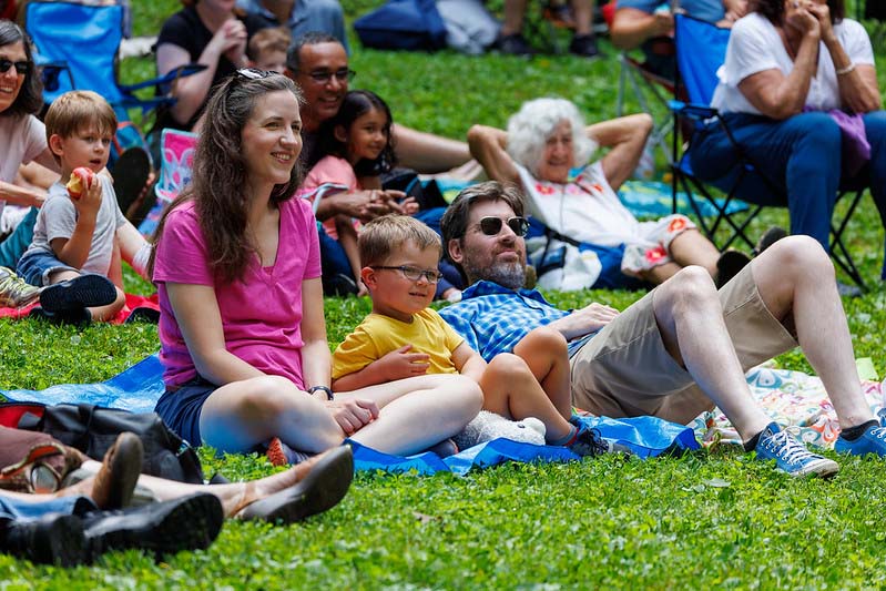 family of 4 watching the Happenstance Theater production in summer of 2023