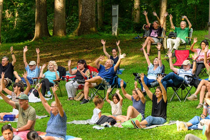 park visitors listening to music at Montgomery parks  summer concert