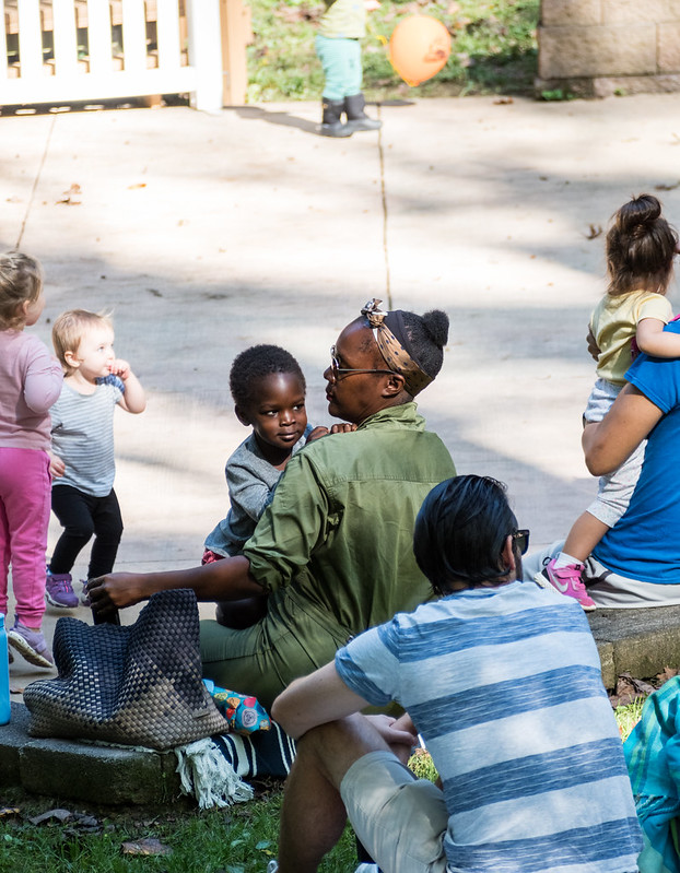 families listing to music at Sunday Serenade April 2024 Cabin John Regional Park