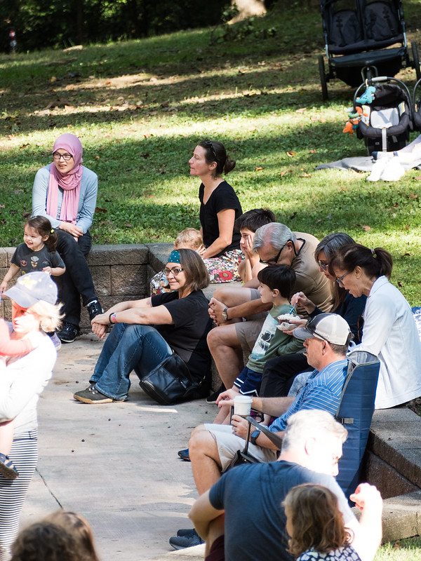 families and friends listening to music at Sunday Serenade April 2024 Cabin John Regional Park